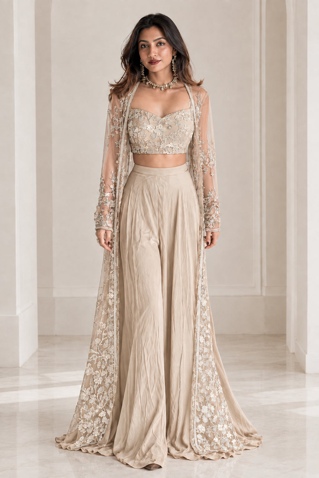 Model wearing champagne beige embroidered 3-piece cape palazzo set