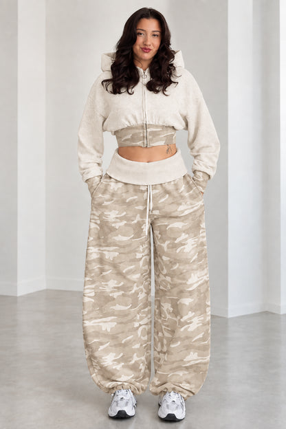 Model wearing Beige cropped zip hoodie and tan camouflage wide-leg sweatpants set
