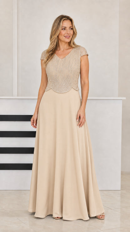 Woman wearing Champagne beige beaded floor-length evening dress