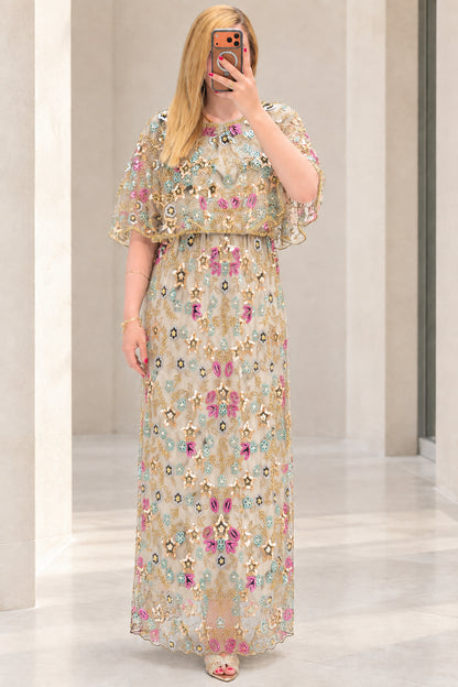 Front view of champagne floral sequin embroidered capelet maxi dress
