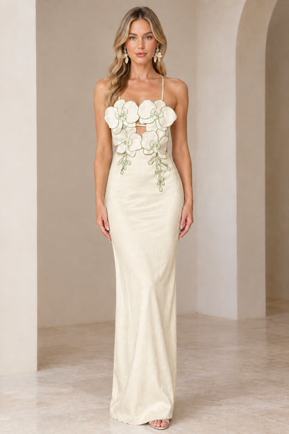 Front view of model wearing Champagne ivory 3D floral maxi gown