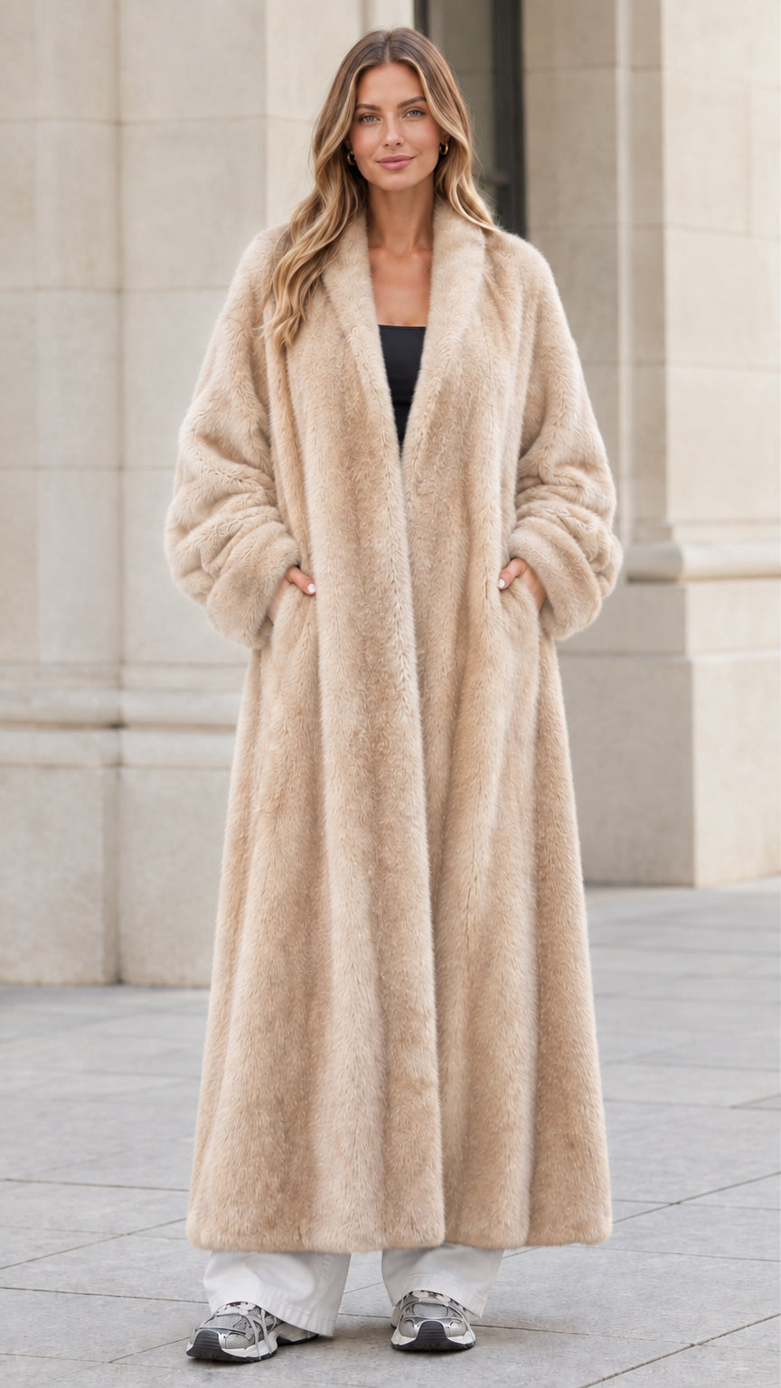 Front view of woman wearing champagne beige longline faux fur maxi coat