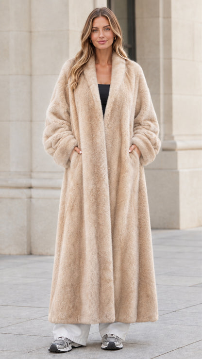 Front view of woman wearing champagne beige longline faux fur maxi coat