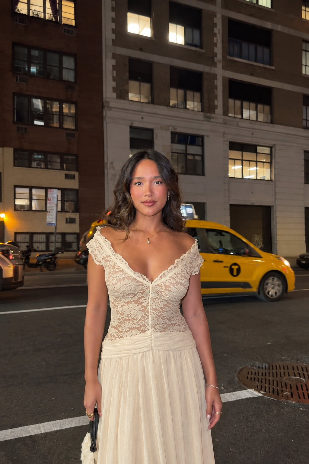 Woman wearing champagne beige lace A-line maxi dress