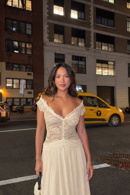 Woman wearing champagne beige lace A-line maxi dress